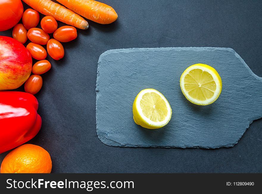 Sliced Lemon On Blue Chopping Board