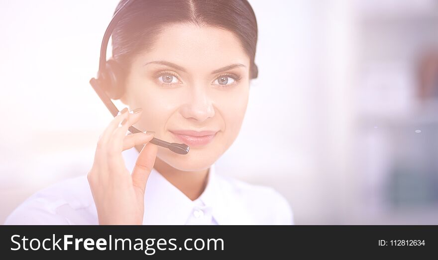 Close-up portrait of a customer service agent sitting at office