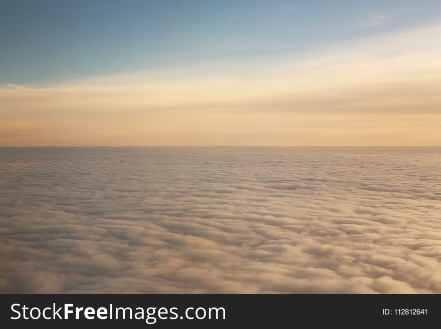 Sunset above the clouds with copy space