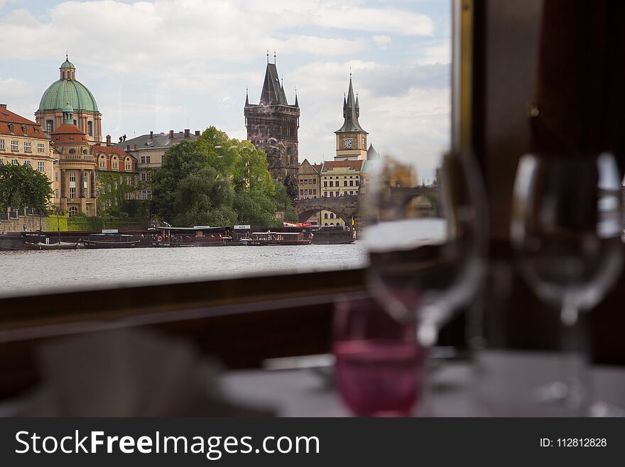 Walk along the Vltava on a river tram. Magnificent Prague, view from the river. A modest dinner on Board