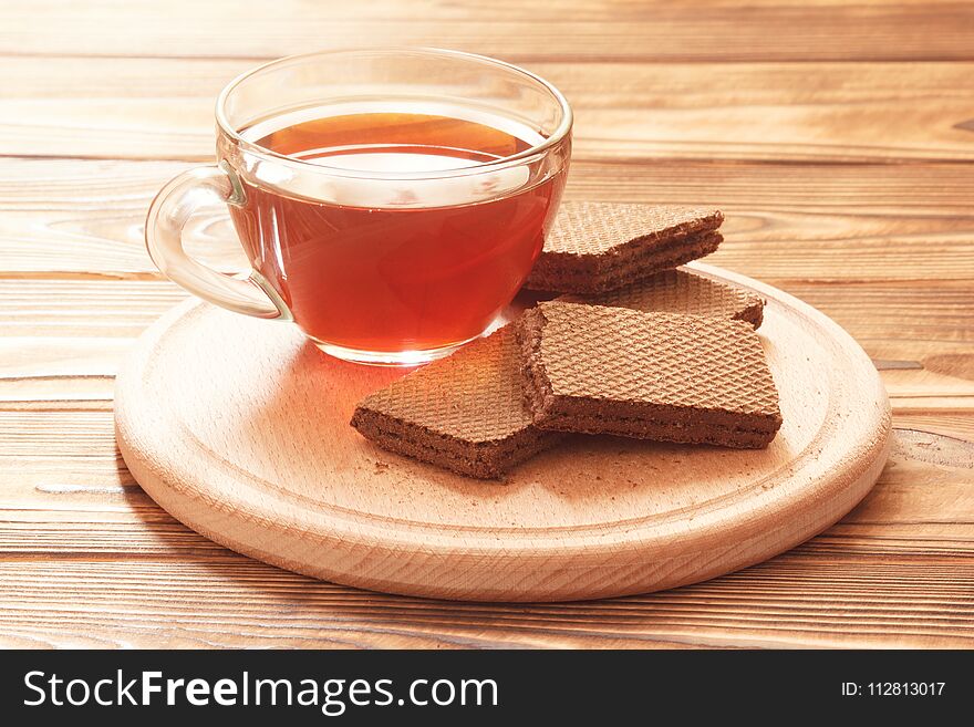 traditional English tea with sweet brown chocolate waffles on plate. traditional English tea with sweet brown chocolate waffles on plate