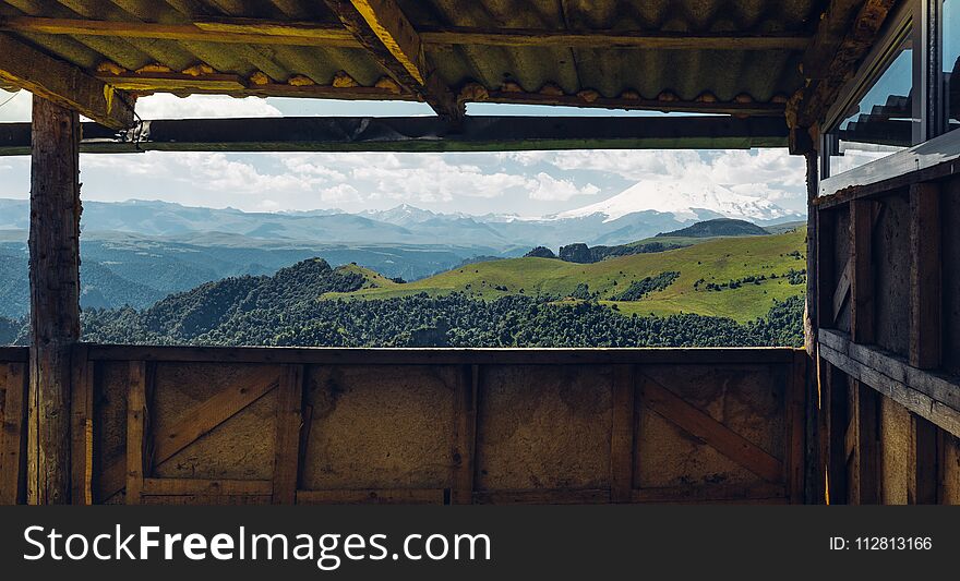 Adventure Trip Camping Concept. Scenic View Of Mount Elbrus From The Veranda Window
