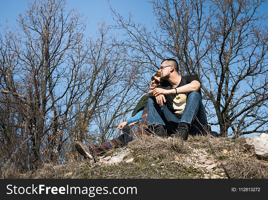 Couple Travelers Man and Woman sitting relax in a hike. Love and Travel happy emotions Lifestyle concept. Young family traveling active adventure.