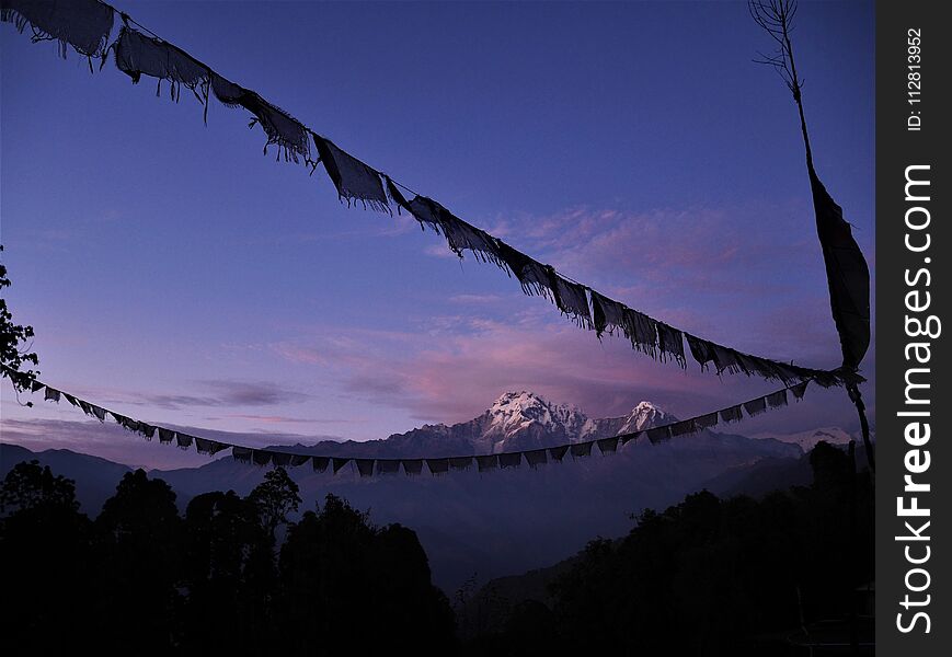 Soft purple sunrise in the Himalayas mountains during new year time hiking