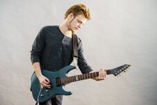 Young Man Playing Electric Guitar Royalty Free Stock Photography
