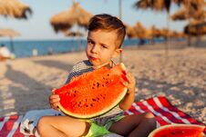 Funny Little Boy Eating Watermelon Royalty Free Stock Photography