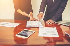 Business People Discussing The Charts And Graphs While Meeting W Stock Images Business People Discussing The Charts And Graphs While Meeting W Stock Images
