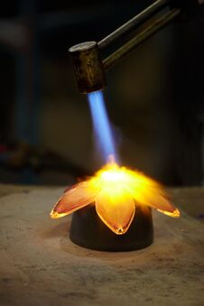 Glass-blower Burns Glass Flower Royalty Free Stock Images