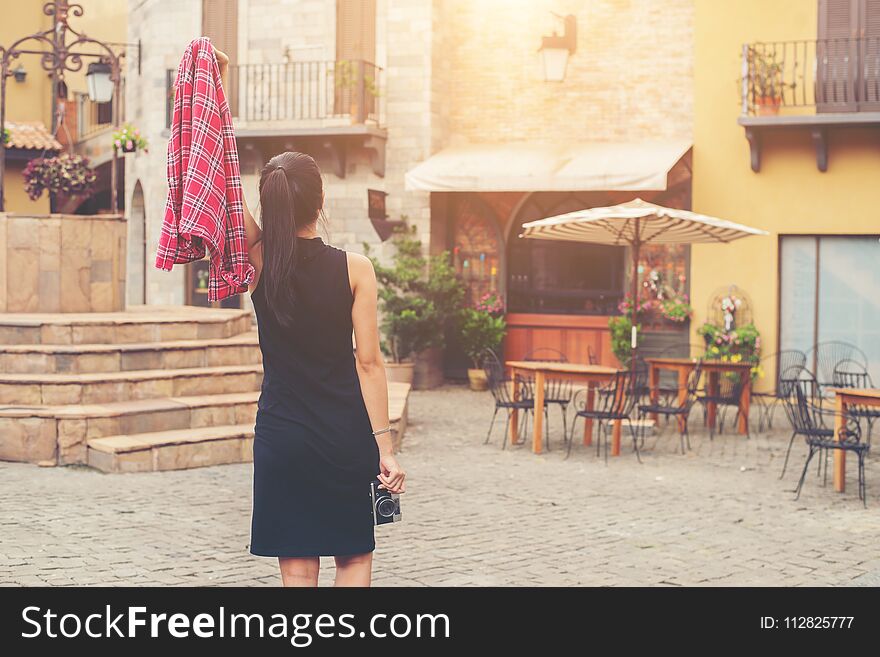 Young beautiful woman with retro camera , Vintage retro style Asian girl on vacation smiling happy.