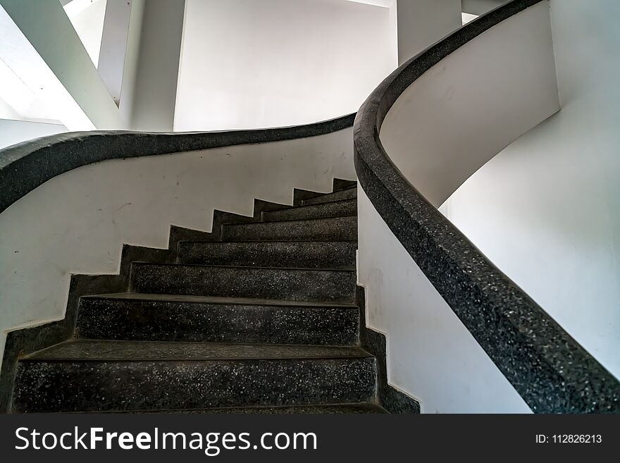 Perspective of black spiral concrete staircase. Perspective of black spiral concrete staircase