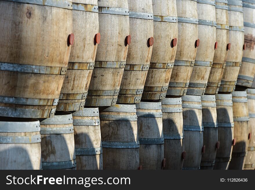 Storage of old barrels in a castle of Bordeaux vineyards, France