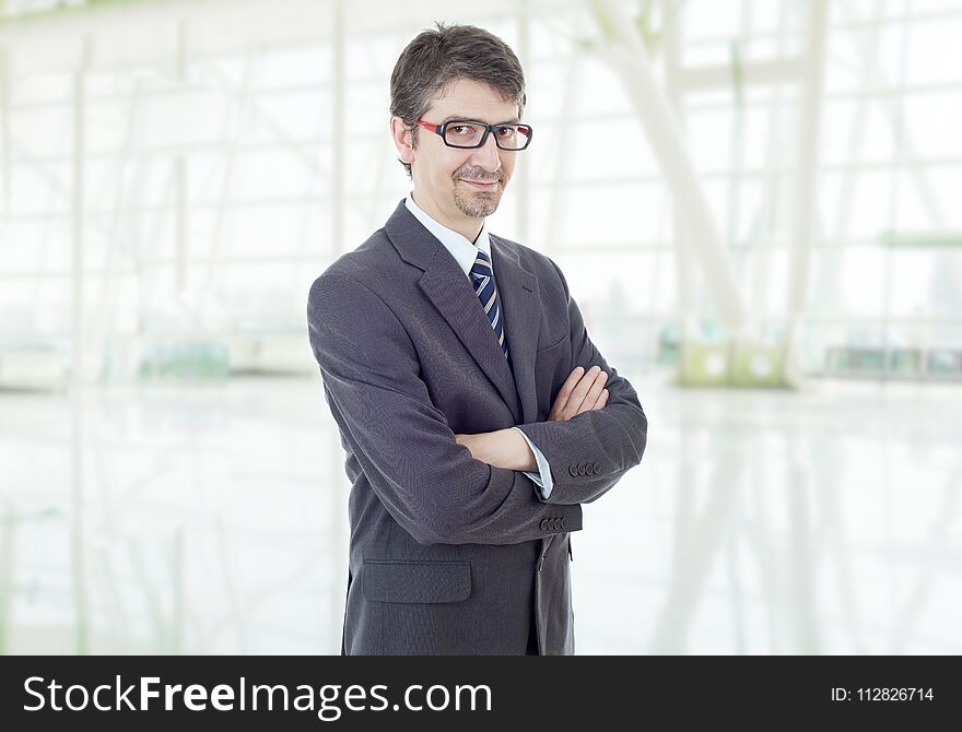 Young business man portrait at the office