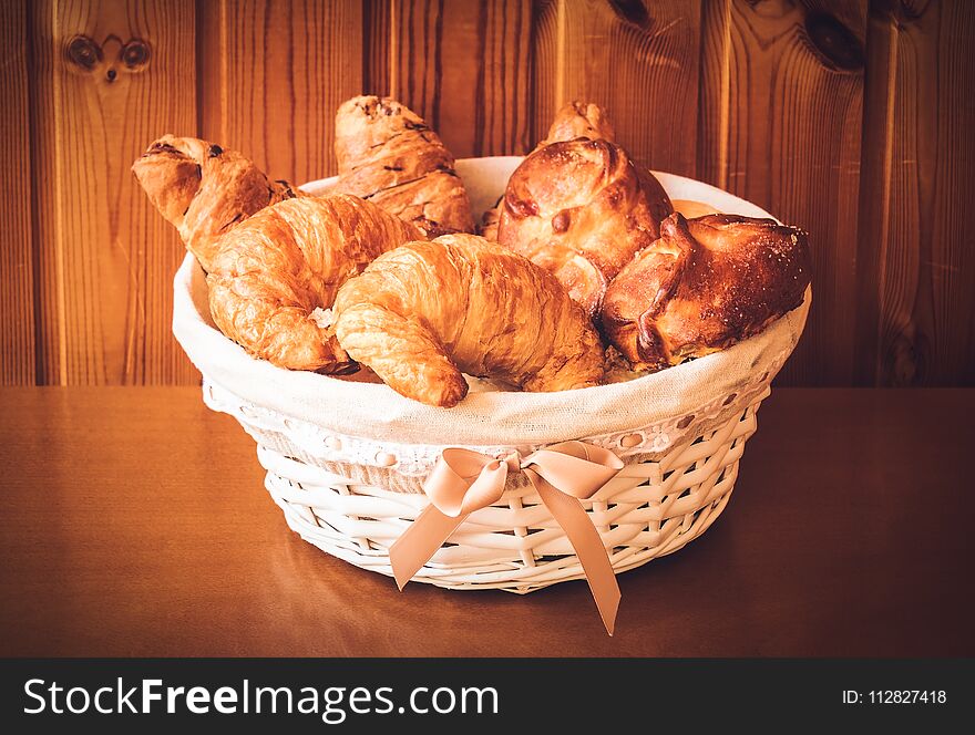 Assorted pastry in basket. Selective focus.