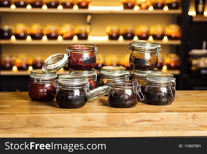 Hookah tobacco in glass banks with different taste standing on the bar counter. Shisha Concept