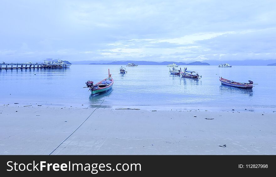 Boat on sea beside beach