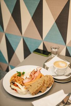 Traditional English Breakfast. A Cup Of Coffee With Cappuccino Is Next To It. National Food. A Famous Dish All Over The Stock Image