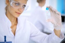 Female Scientific Researcher In Laboratory Studying Substances Or Blood Sample. Medicine And Science Concept Royalty Free Stock Image