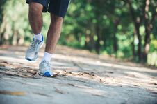 Close Up Foot Of Young Runner Man Running Along Road In The Park Royalty Free Stock Photography Close Up Foot Of Young Runner Man Running Along Road In The Park Royalty Free Stock Photography