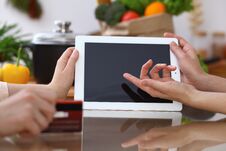 Closeup Of Human Hands Cooking In Kitchen. Women Discuss A Menu Using Tablet Computer. Copy Space Area At Touch Pad Stock Photos