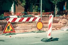 Work Ahead Street Reconstruction Site With Sign And Fence As Road Barricade Royalty Free Stock Images