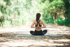 Young Asian Woman Doing Yoga In The Morning At The Park. Healthy Royalty Free Stock Photography