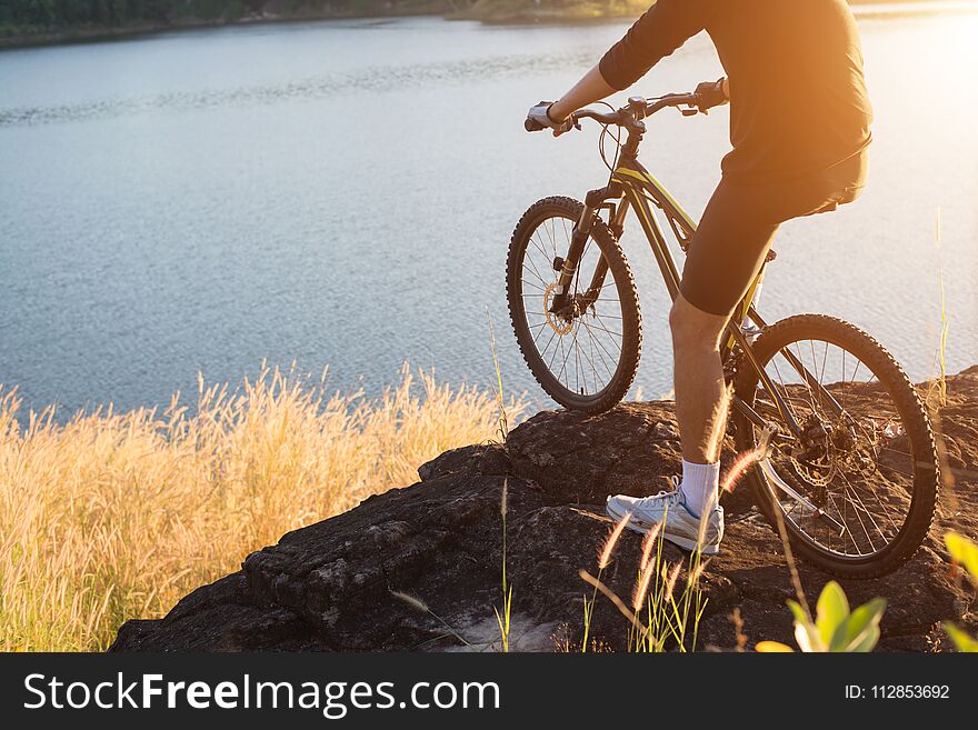 Cyclist on the mountain top of lake, Extreme and adventure life.