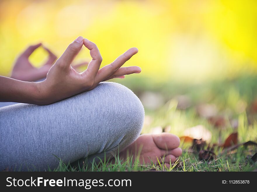 Asian girl doing yoga in the park To express the calm of the surrounding. Increase concentration within the mind. Asian girl doing yoga in the park To express the calm of the surrounding. Increase concentration within the mind.