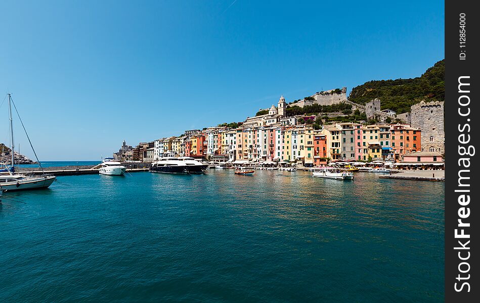 Beautiful medieval fisherman town of Portovenere bay near Cinque Terre, Liguria, Italy. Harbor wit boats and yachts. People are unrecognizable. Beautiful medieval fisherman town of Portovenere bay near Cinque Terre, Liguria, Italy. Harbor wit boats and yachts. People are unrecognizable.