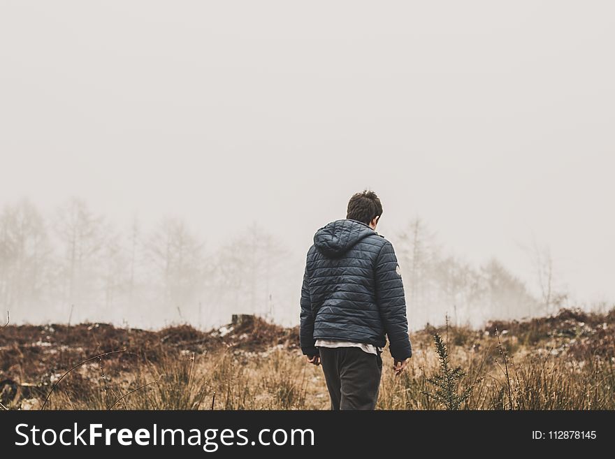 Man Wearing Blue Bubble Jacket