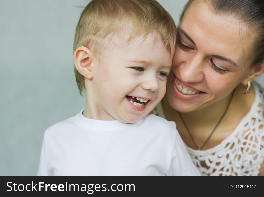 love family. a happy family. mother and child on a white background smiling.