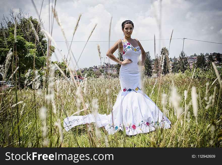 Woman Standing on Grass Field Wearing Mermaid Dress