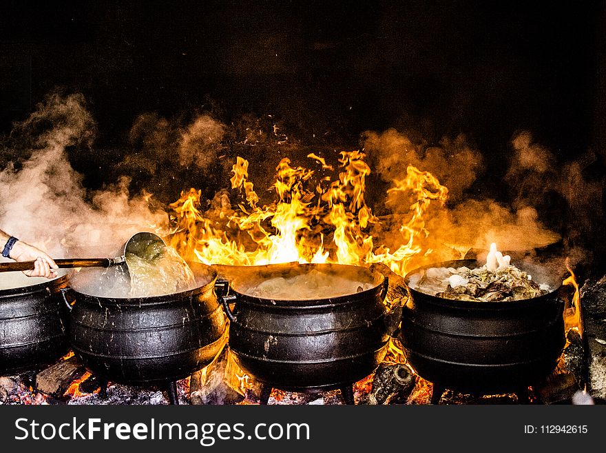 Time Lapse Photography of Four Black Metal Cooking Wares