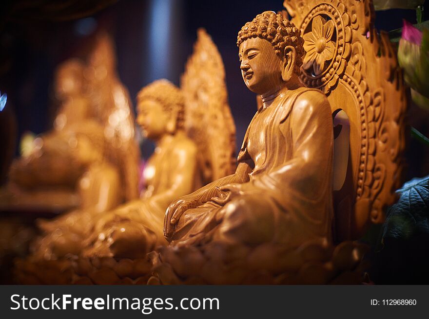 Several Wooden Carved Buddha Statues In The Buddhist Temple