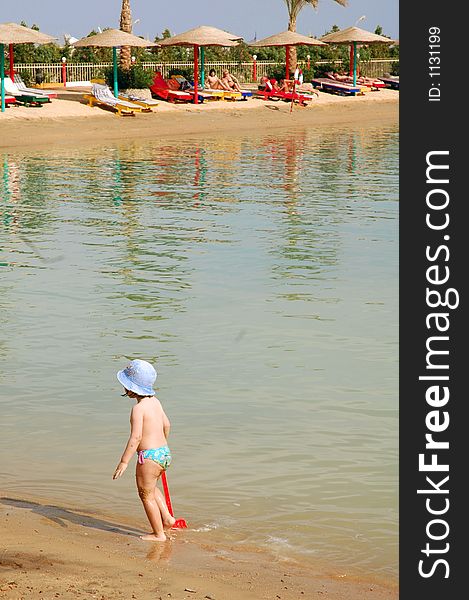 Child walking in the water at an Egyptian resort. Child walking in the water at an Egyptian resort