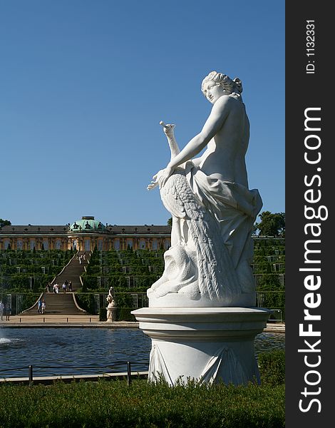 The castle of Sanssouci with a statue of a woman