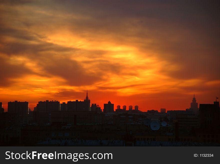 Fiery sunset over a big city