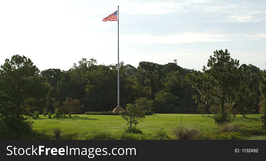 Flag Pole at the picnic area across the lake.  Photographed at Walsingham Park in Largo Florida. Flag Pole at the picnic area across the lake.  Photographed at Walsingham Park in Largo Florida