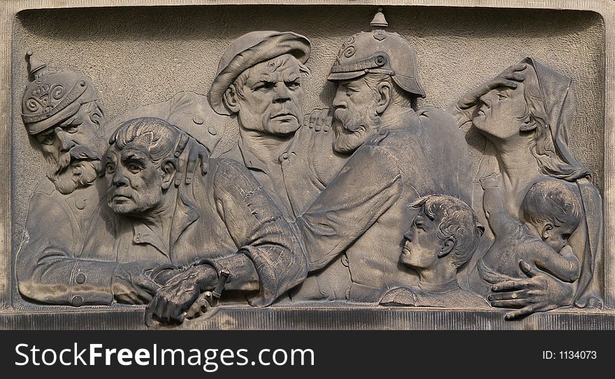 Ornament at a German police station, ca 1890: policemen protecting a women with children, arresting two criminals. Ornament at a German police station, ca 1890: policemen protecting a women with children, arresting two criminals.