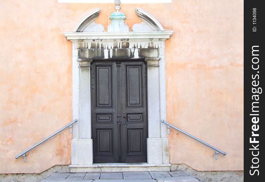 Old church portal with apricot background