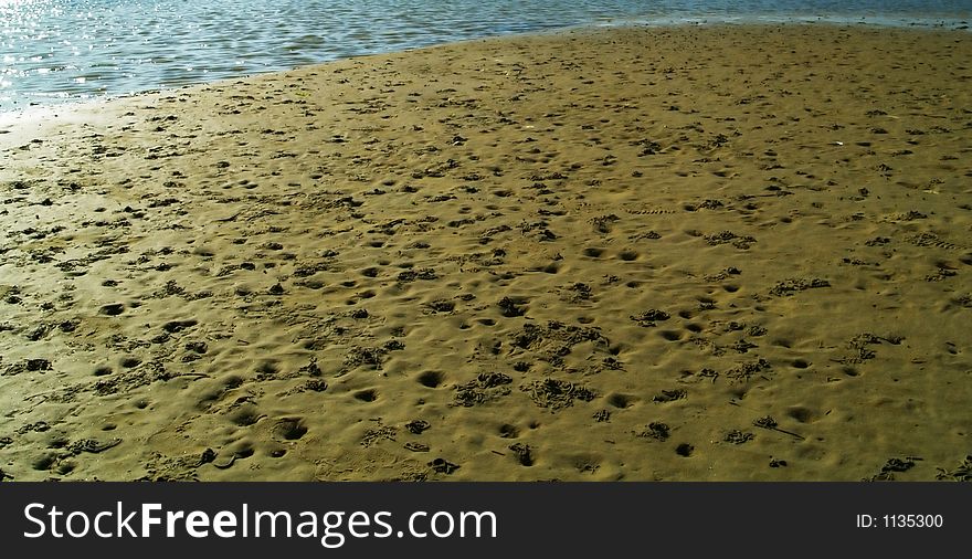 On the beach : sand and water