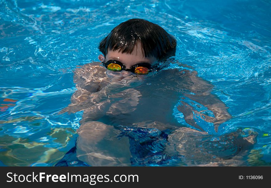 Young boy holding breath underwater. Young boy holding breath underwater