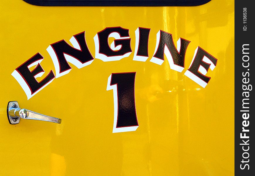 The yellow door on a fire engine truck. The yellow door on a fire engine truck.