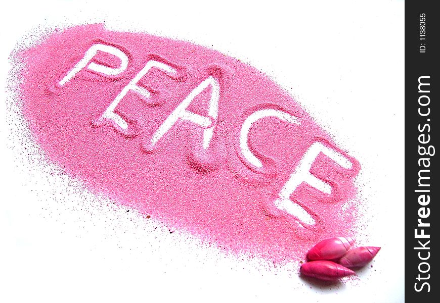 The word peace in pink sand. The word peace in pink sand