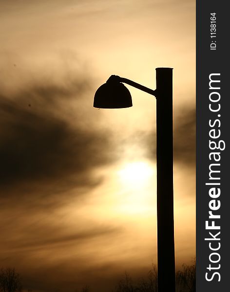Silhouette of a public lamp in sunset in denmark