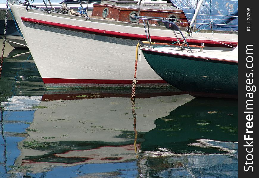 Bows of two fishing boats in harbor. Bows of two fishing boats in harbor