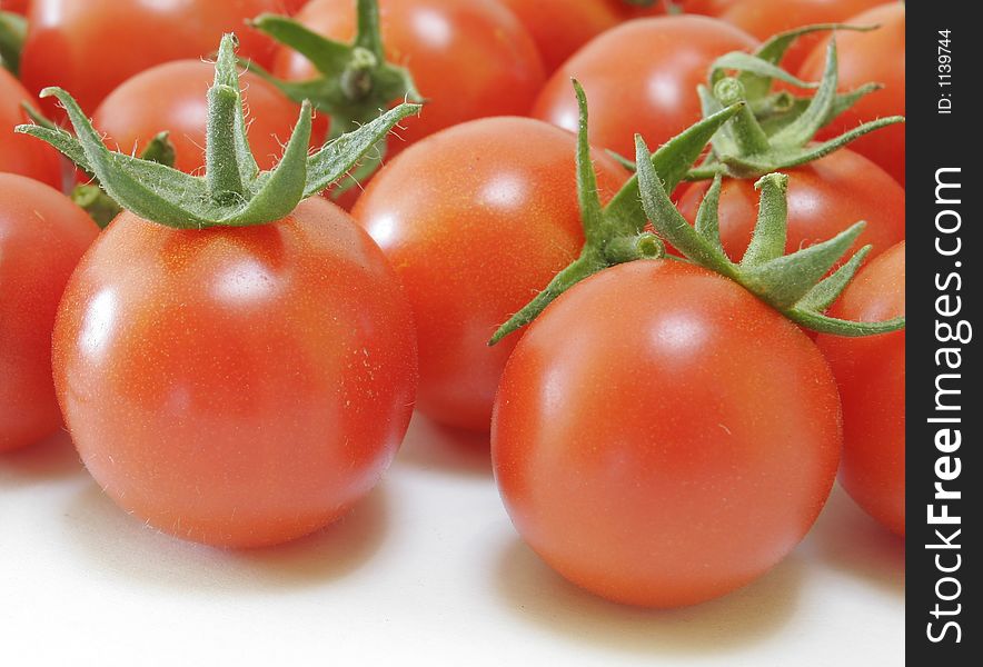 Red Tomatoes on white background. Red Tomatoes on white background.