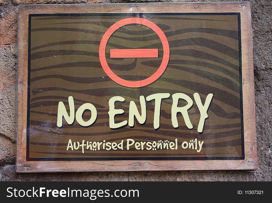 A sign with 'no entry' - 'authorised personnel only' on display