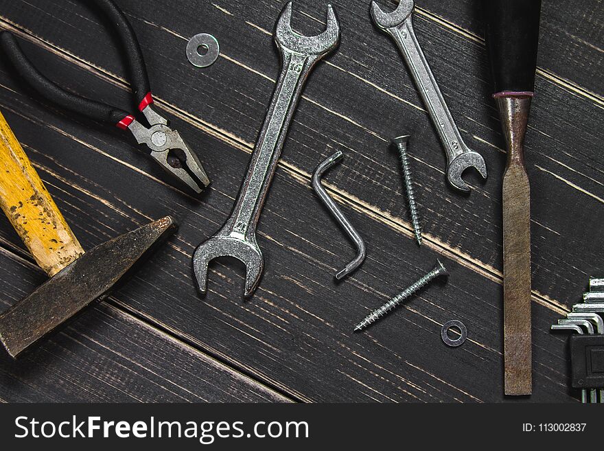Joinery tools on a dark wooden table. Place for the text. A conc