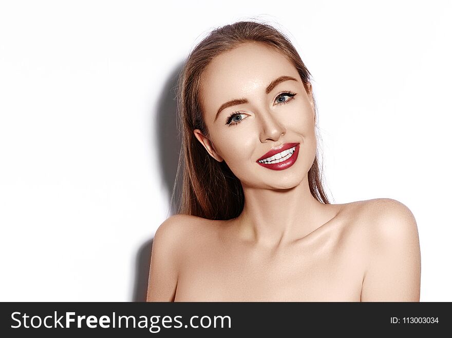smiling woman with Glamour Red Lips, bright Makeup, clean Skin. Smile with White Teeth. Happy Fashion Girl