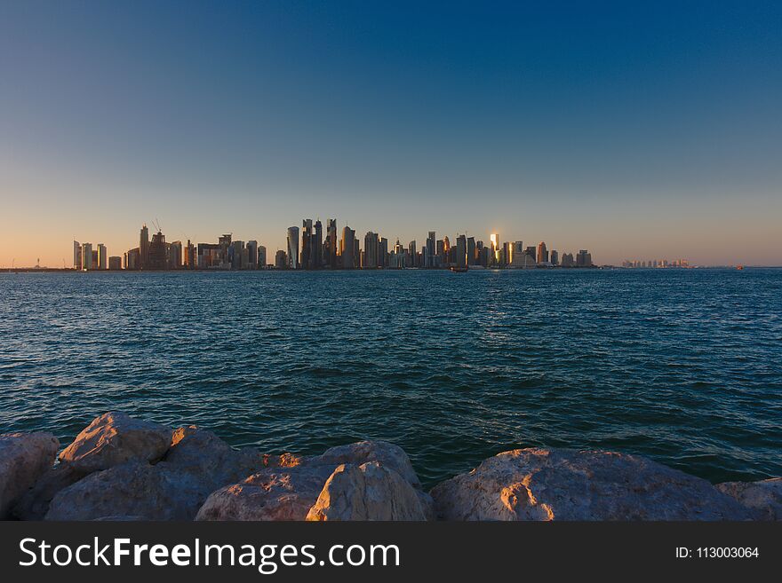 Skyline of West Bay, at sunset from the Dhow Harbour. Doha, Qatar.
